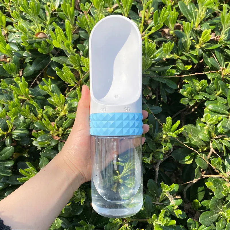 Portable dog water cup with one-click lock, food-grade ABS construction, available in various colours for outdoor pet hydration