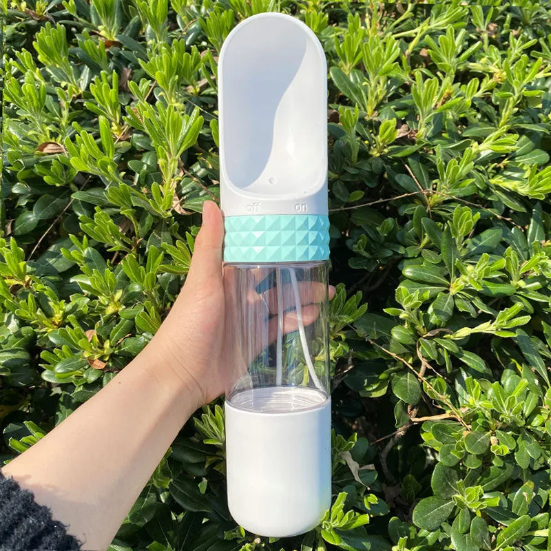 Portable dog water cup with one-click lock, food-grade ABS construction, available in various colours for outdoor pet hydration