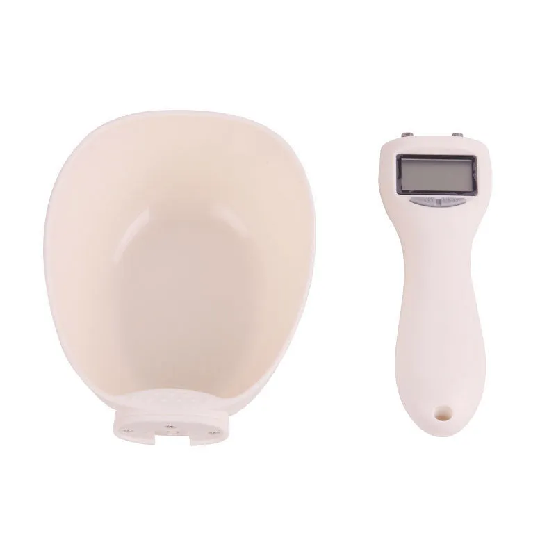 White ABS plastic smart weighing pet food shovel with digital display, 250ml capacity, 23cm length.