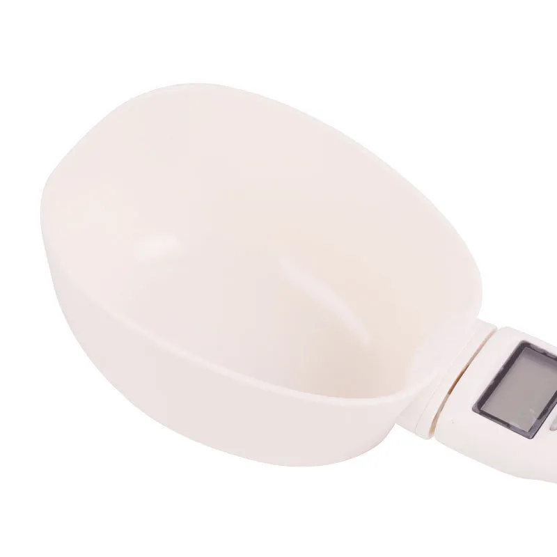 White ABS plastic smart weighing pet food shovel with digital display, 250ml capacity, 23cm length.