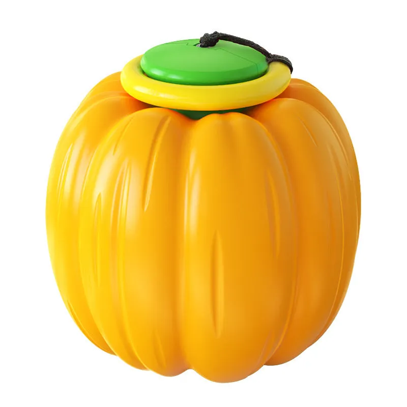 Pumpkin-shaped orange dog chew ball with squeaker for small dogs on a wooden floor.