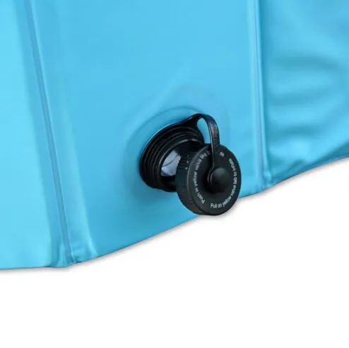 Foldable blue dog swimming pool with thickened PVC material and quick drain valve, set up on grass