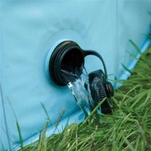 Foldable blue dog swimming pool with thickened PVC material and quick drain valve, set up on grass