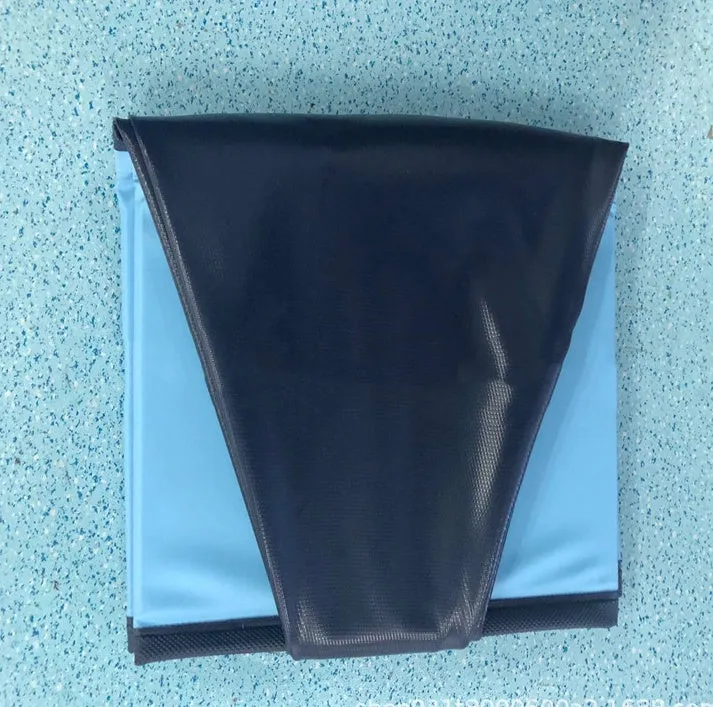Foldable blue dog swimming pool with thickened PVC material and quick drain valve, set up on grass