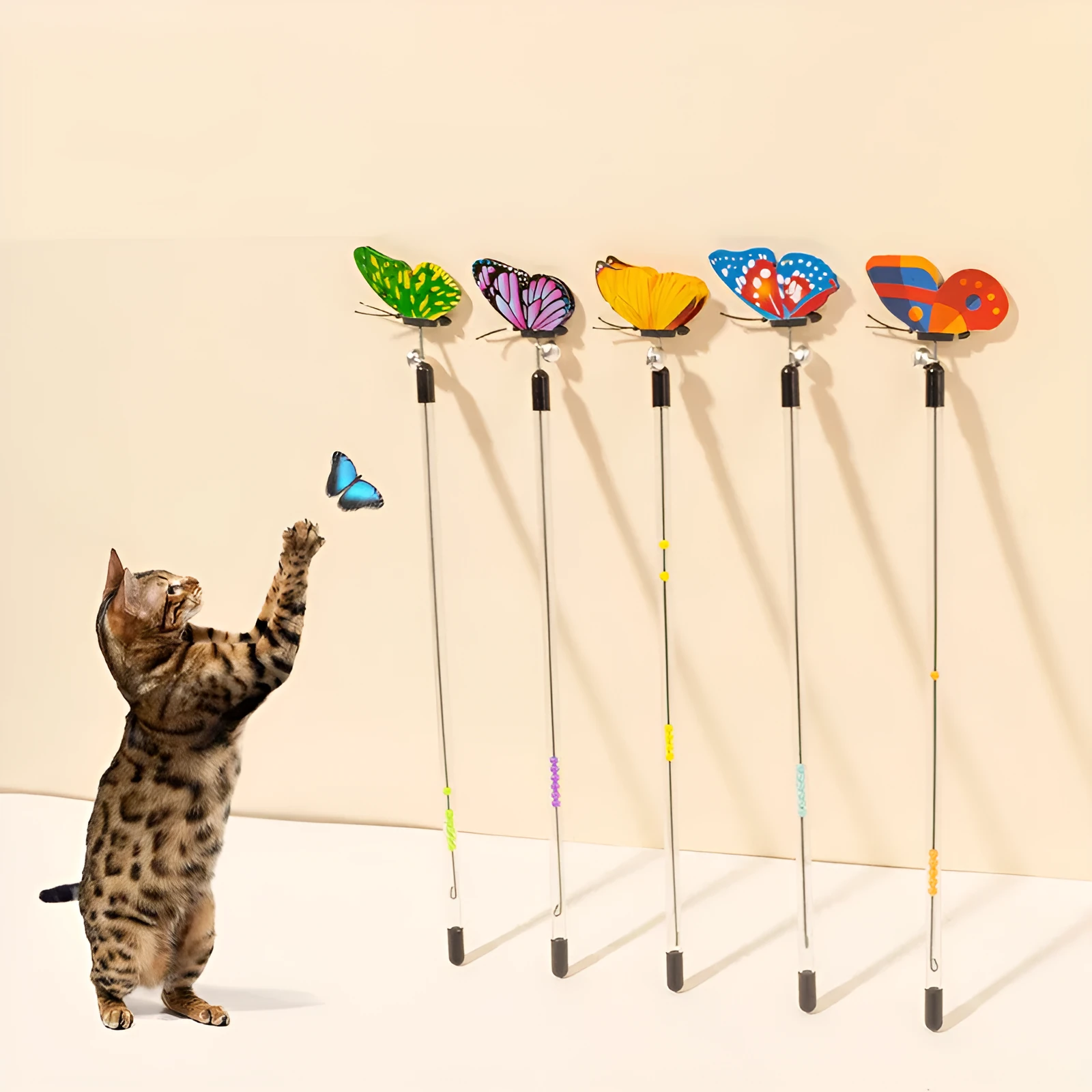 Retractable cat teasing stick with spring butterfly attachment in mixed hair colours, full length 30-50cm on a light background