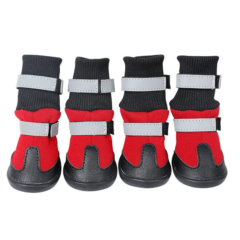 Pair of black wear-resistant waterproof snow boots with non-slip sole on snowy ground