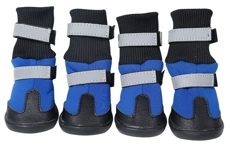 Pair of black wear-resistant waterproof snow boots with non-slip sole on snowy ground