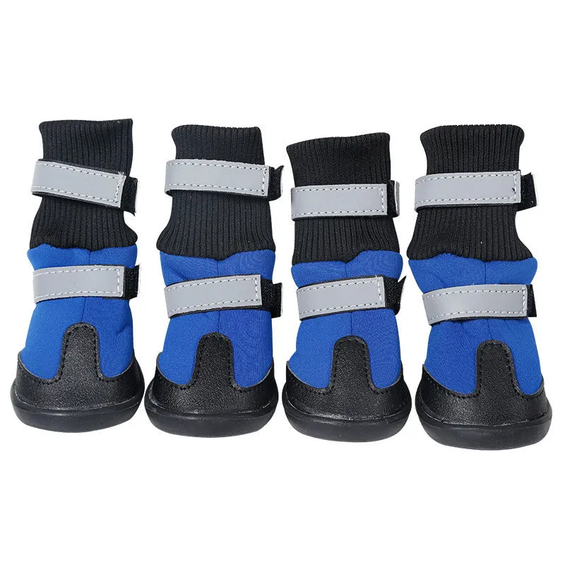 Pair of black wear-resistant waterproof snow boots with non-slip sole on snowy ground