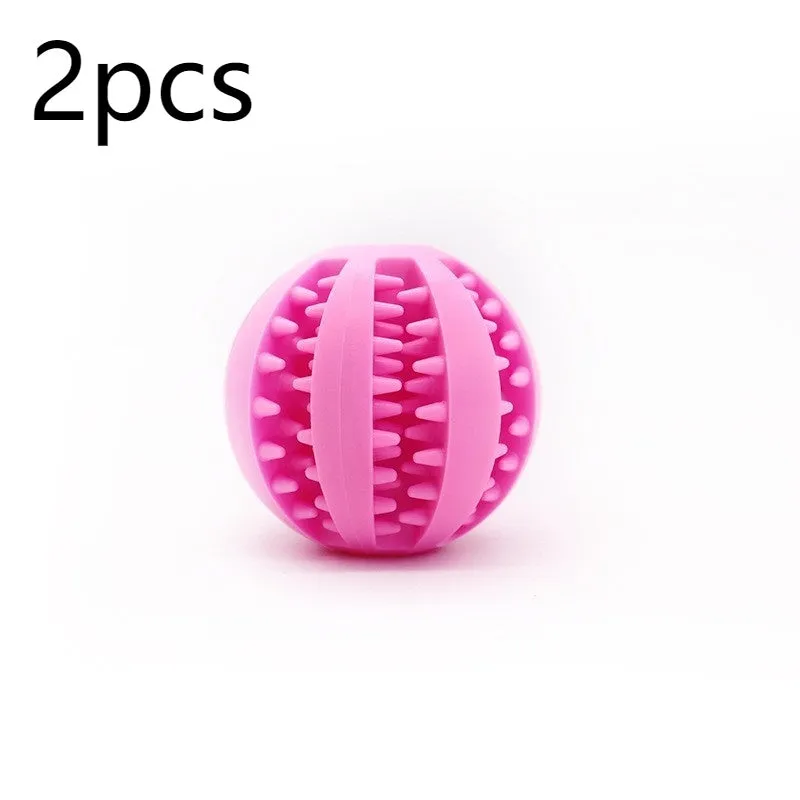 Small pink rubber pet dog toy self-hi relieving stuffy molars chew toy 5cm diameter on white background