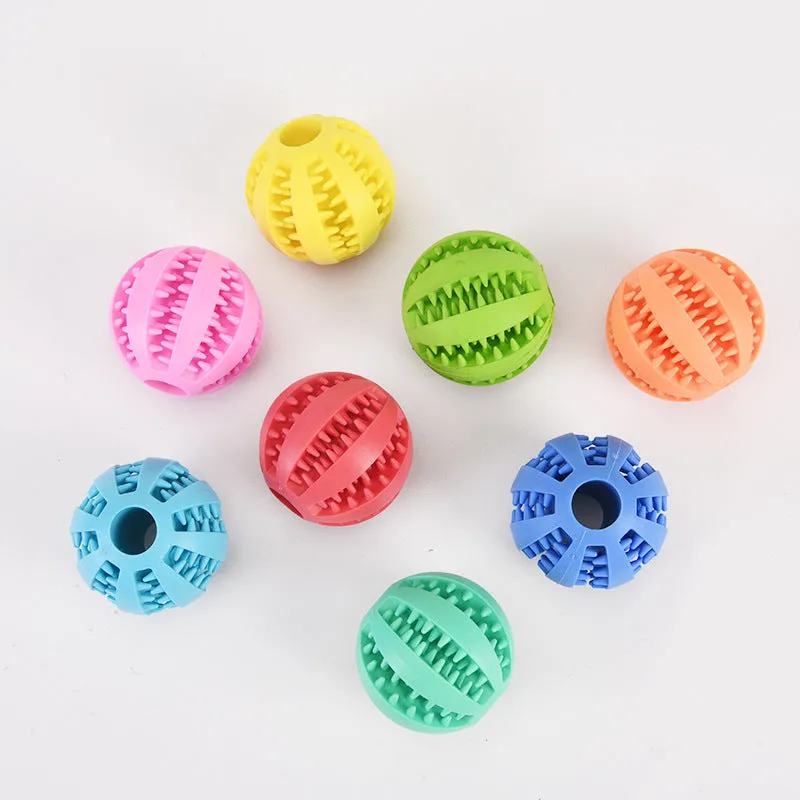 Small pink rubber pet dog toy self-hi relieving stuffy molars chew toy 5cm diameter on white background