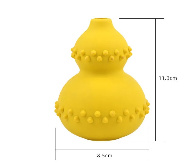Natural rubber pet toy resistant to biting and grinding, treat dispensing ball in red, 11.3 by 8.5 cm