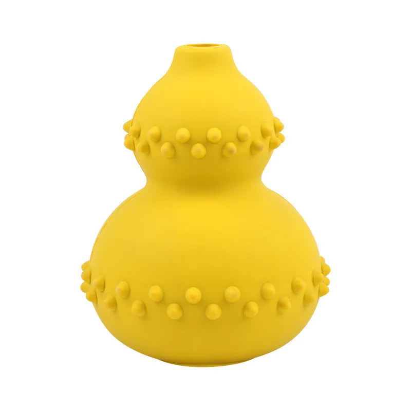 Natural rubber pet toy resistant to biting and grinding, treat dispensing ball in red, 11.3 by 8.5 cm