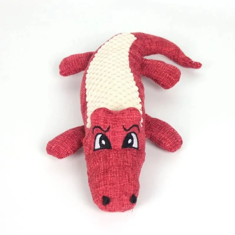 Blue, green, and red corn-shaped plush pet toys with a grid texture on a white background