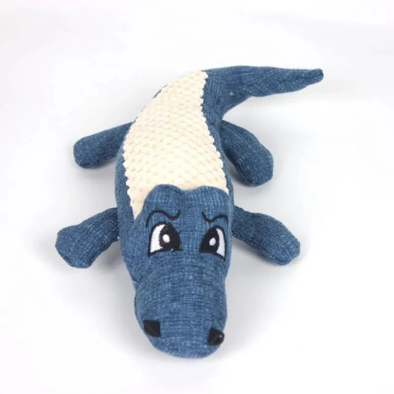 Blue, green, and red corn-shaped plush pet toys with a grid texture on a white background