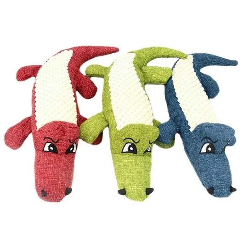 Blue, green, and red corn-shaped plush pet toys with a grid texture on a white background