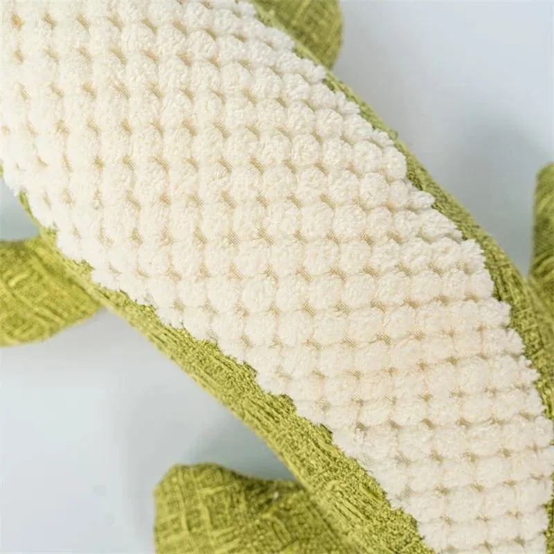 Blue, green, and red corn-shaped plush pet toys with a grid texture on a white background