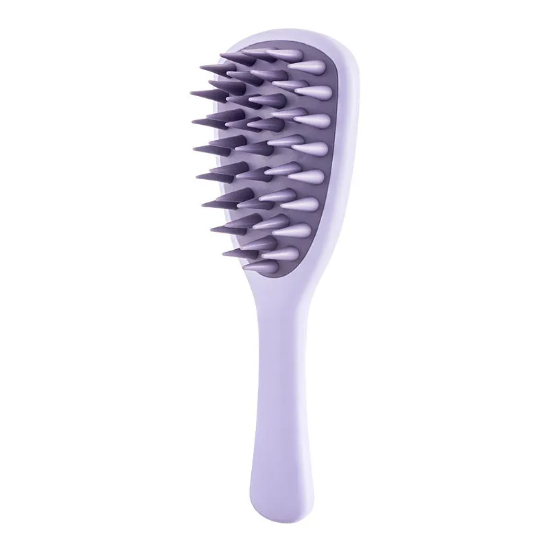 Purple pet silicone shampoo brush with handle on a wet dog coat, designed for gentle bathing and hair removal