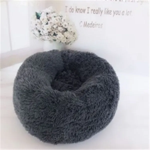 Round long-hairy pet bed in soft plush with 4cm pile, non-slip bottom, suitable for cats and dogs