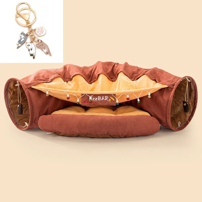 Collapsible cloth cat tunnel in Pink colour with visible opening, measuring 45x50x22 cm, on wooden floor