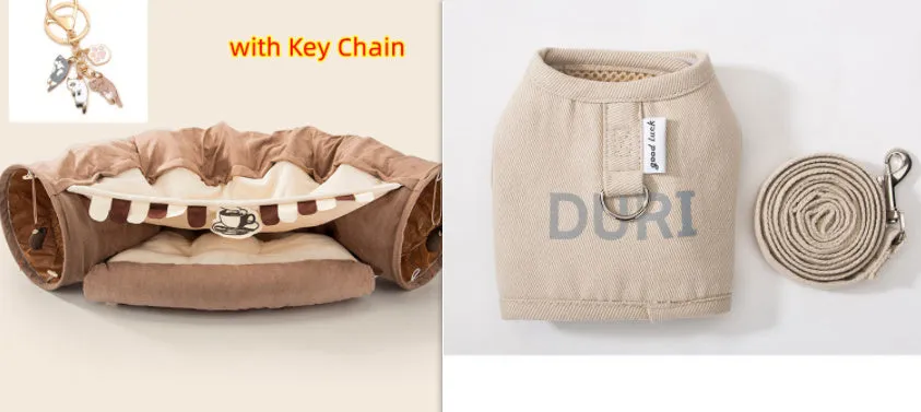 Collapsible cloth cat tunnel in Pink colour with visible opening, measuring 45x50x22 cm, on wooden floor