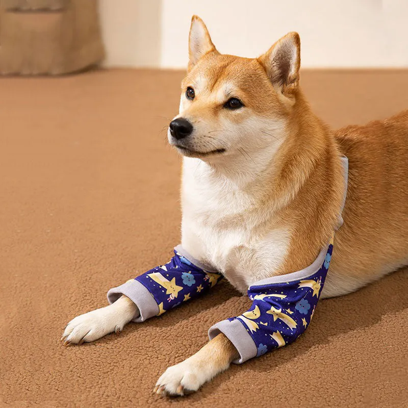 Blue adjustable dog knee protector sleeve with padded elbow patch and matching scarf laid flat.
