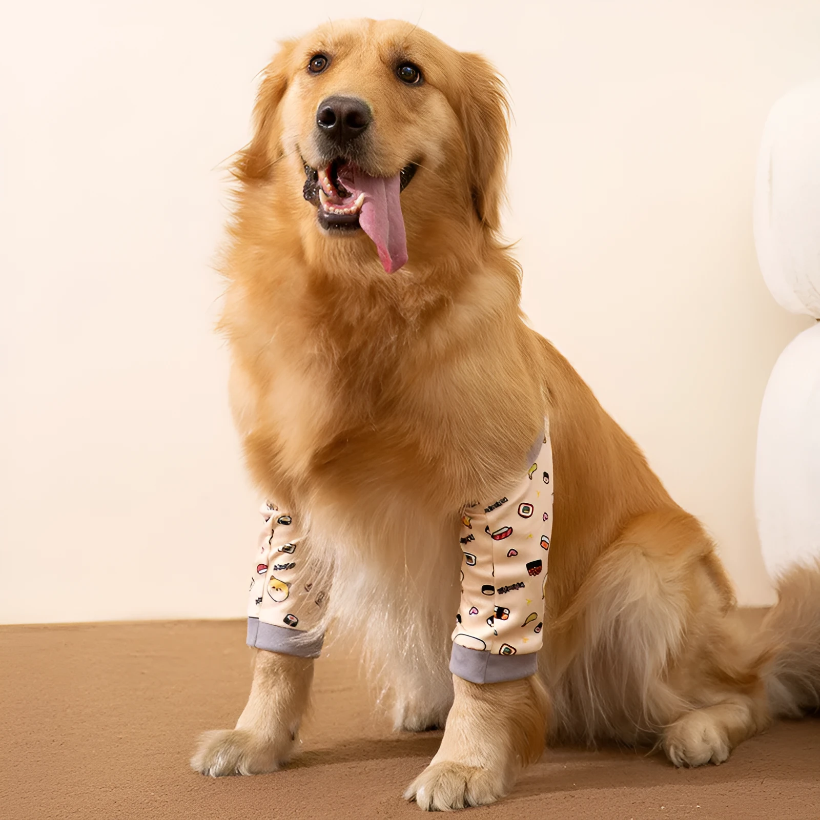 Blue adjustable dog knee protector sleeve with padded elbow patch and matching scarf laid flat.