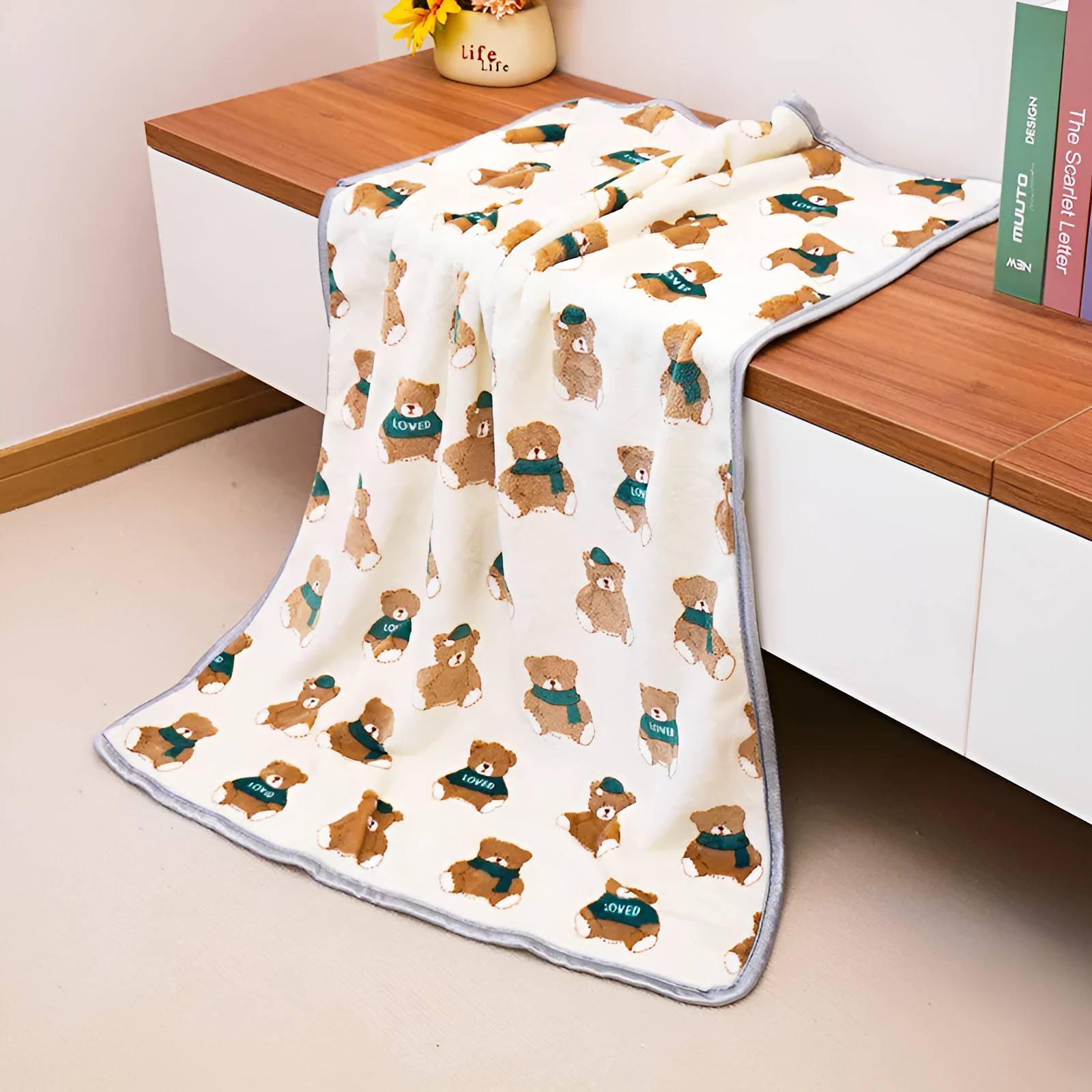 Soft warm pet blanket in pink for dogs and cats, size M, on a pet bed