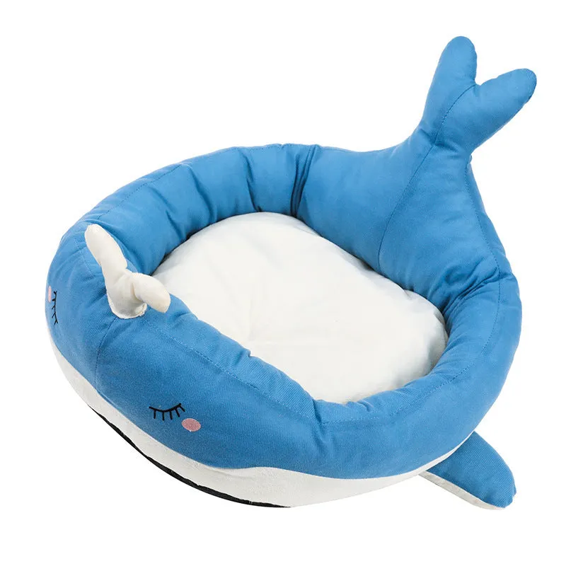 Blue duck-shaped fluffy pet bed for small dogs and cats on a wooden floor.