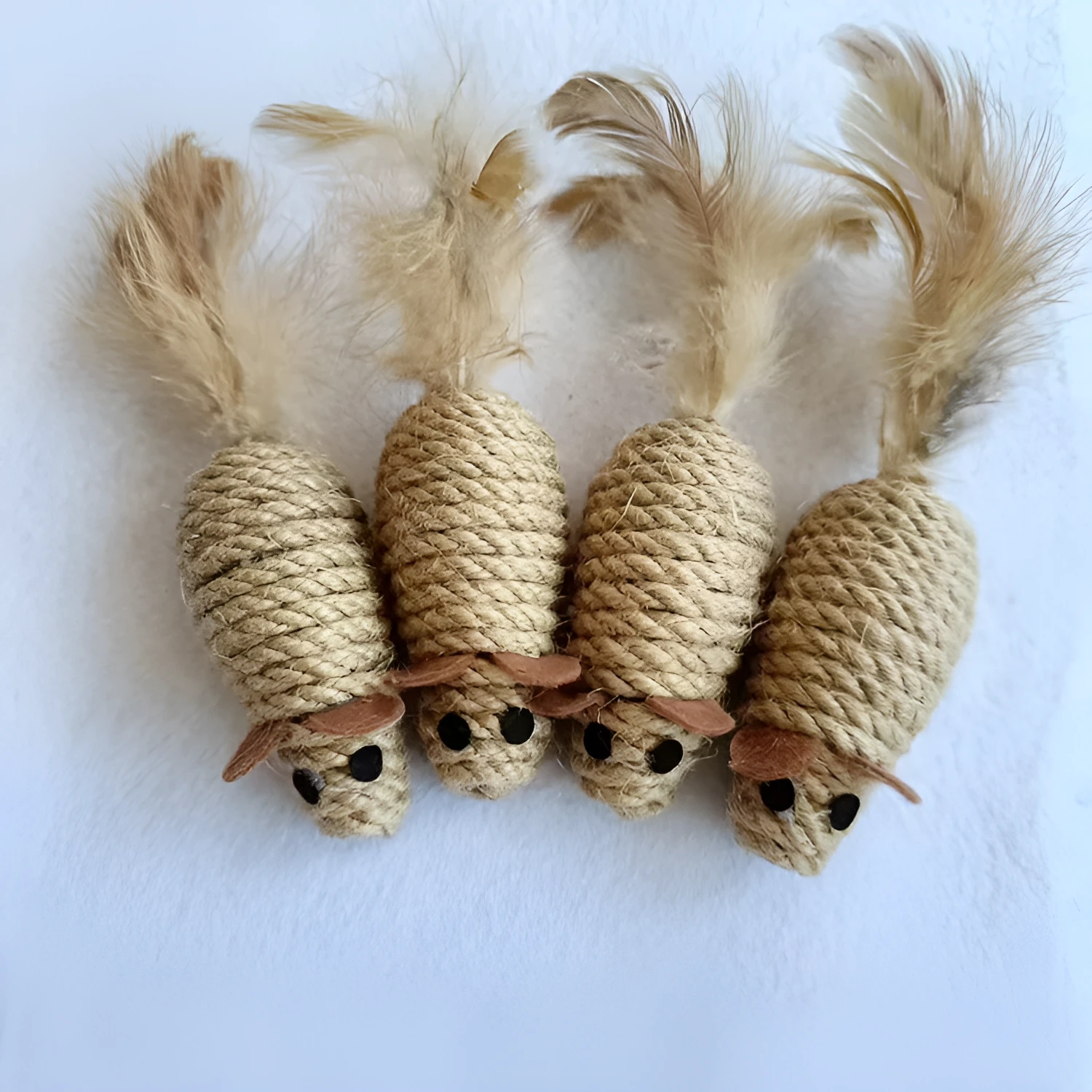 Bite ball molar pet toy made from cotton strips and sisal rope, shown as oval sisal mouse