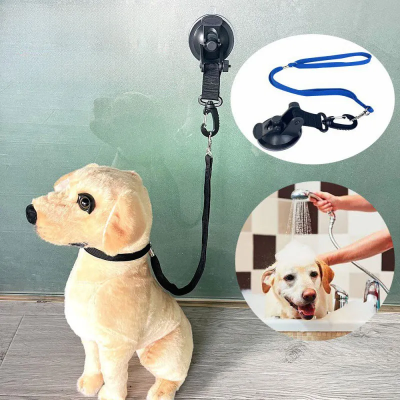 Pet bath restraint kit with four blue suction cup handcuffs and a connecting rope on bathroom tiles.
