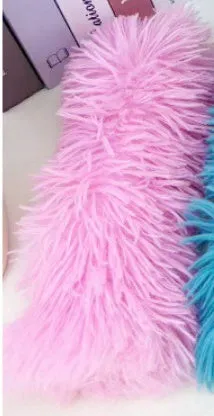 Plush cat toy pillow in blue, green, pink, and white colours, shown at 27cm by 10cm size