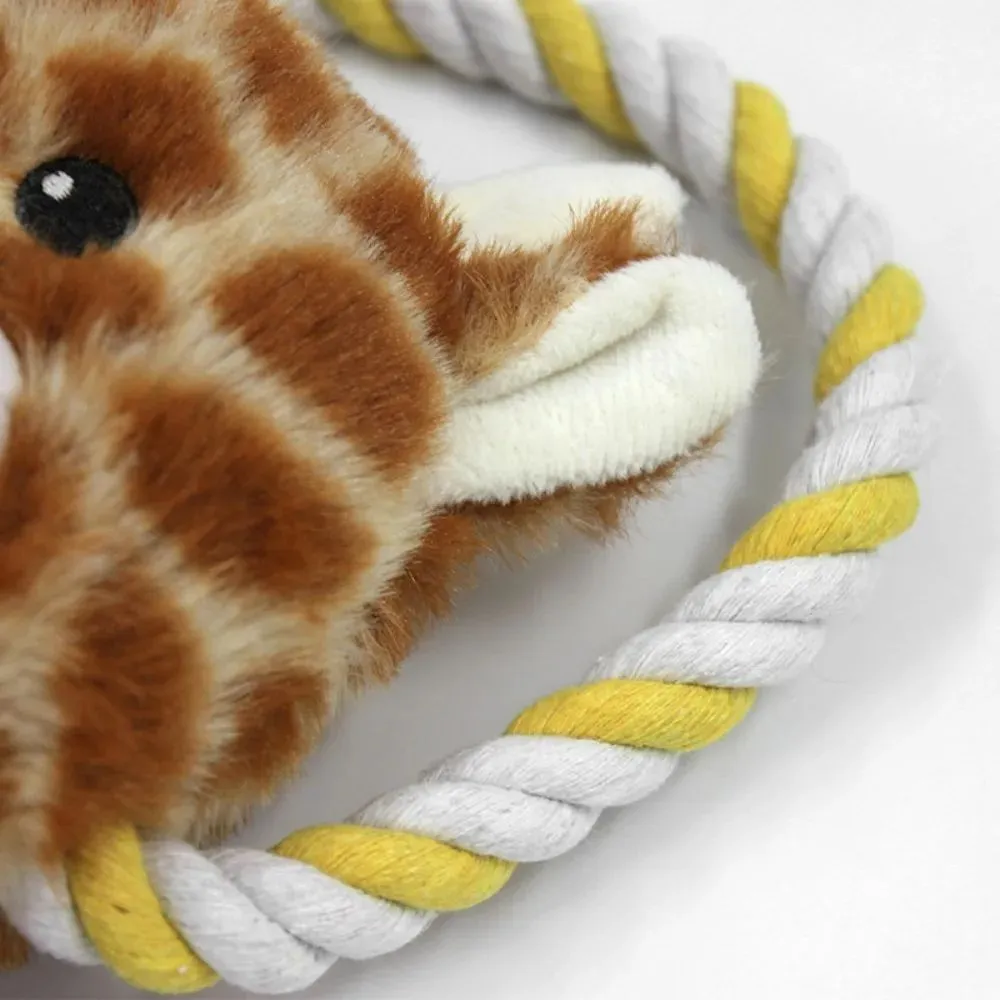 Plush dog toy shaped like zebra with rope and squeaker on white background