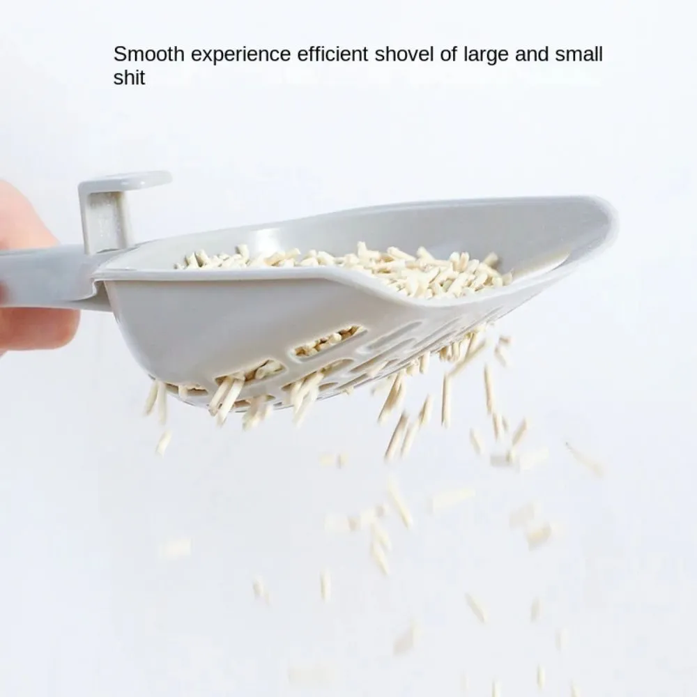 Grey plastic cat litter scoop with detachable base stand showing drainage slots