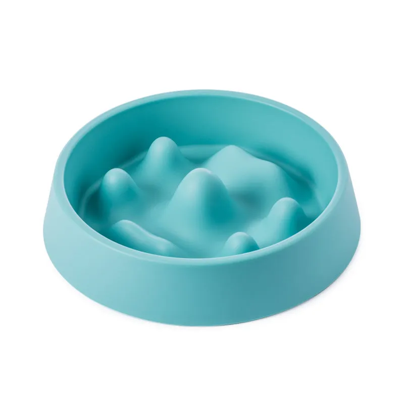 Pet slow food bowl with raised mountain bumps in off-white colour on a floor mat