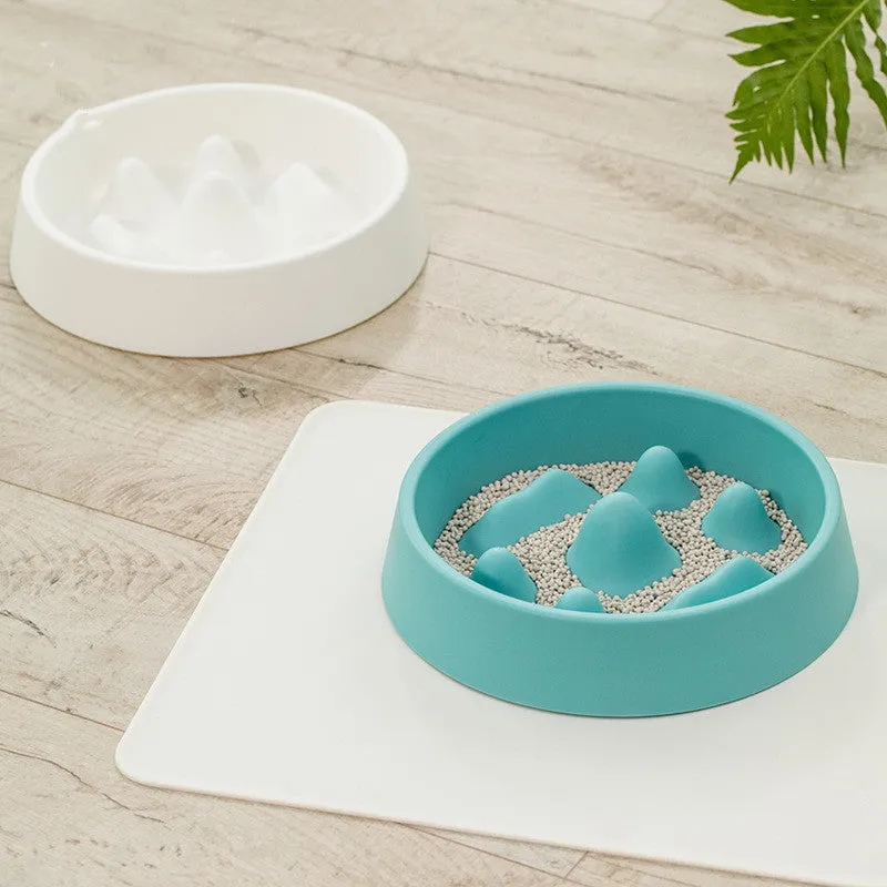 Pet slow food bowl with raised mountain bumps in off-white colour on a floor mat