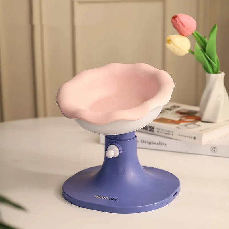 Adjustable ceramic cat feeding bowl in ice cream shape with pink and blue colour on a plastic base