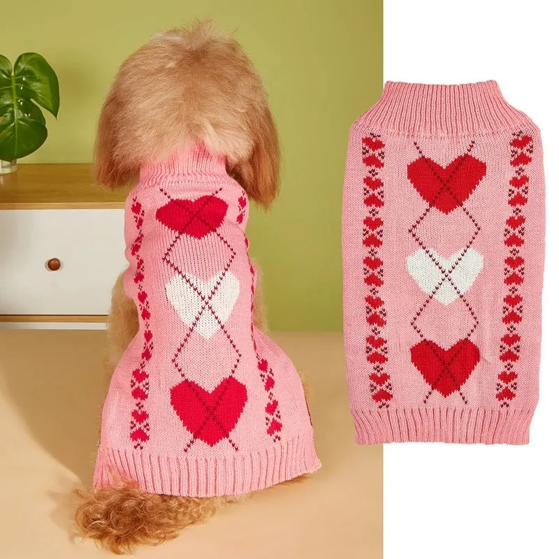 Dog wearing acrylic jumper with decorative heart or bow design in pink or red colours