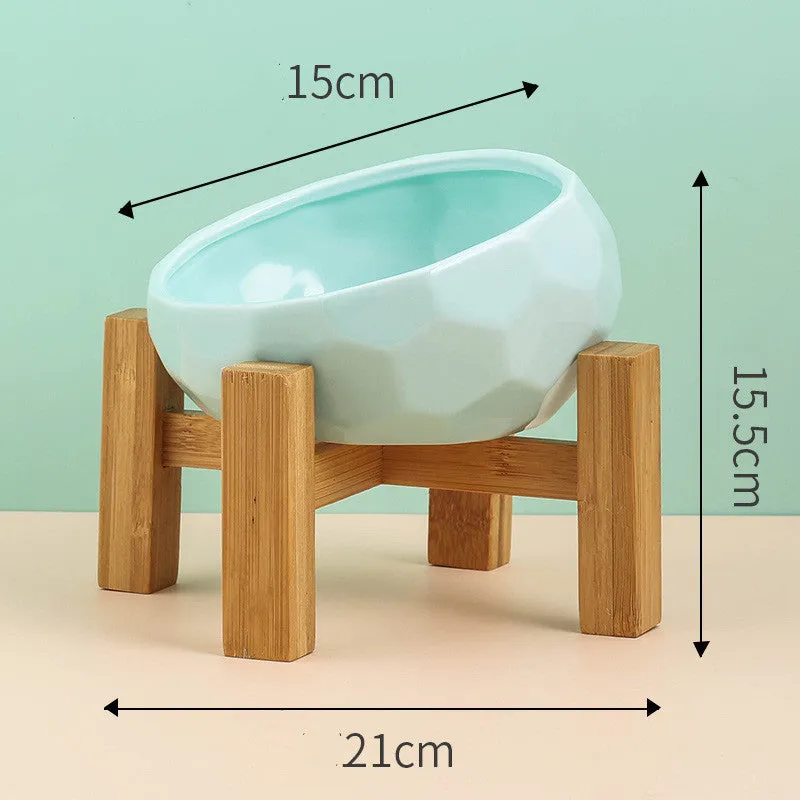 Ceramic cat bowl with oblique mouth design in white colour option on a surface