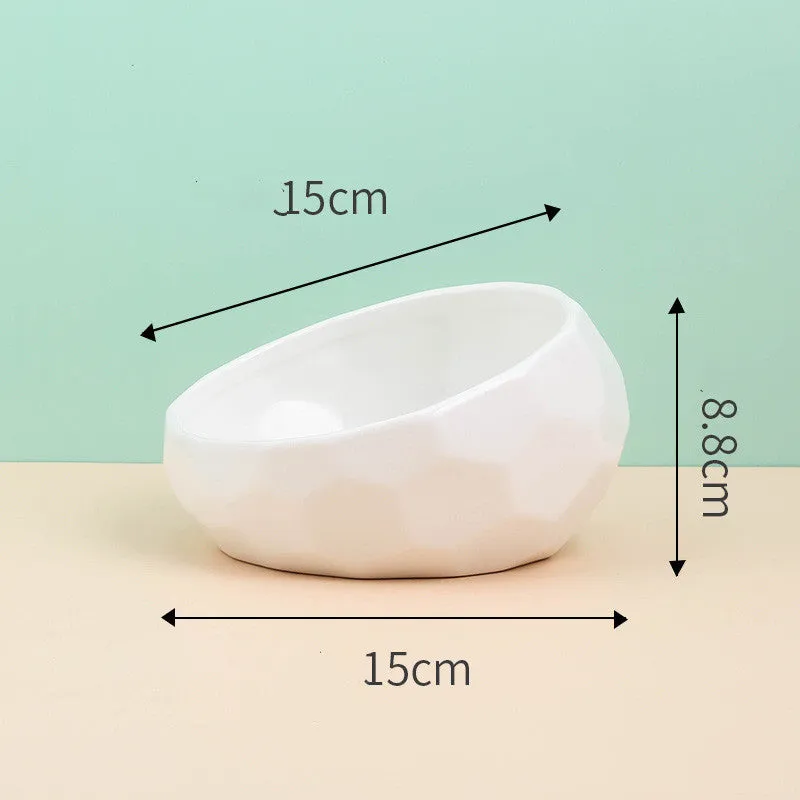 Ceramic cat bowl with oblique mouth design in white colour option on a surface