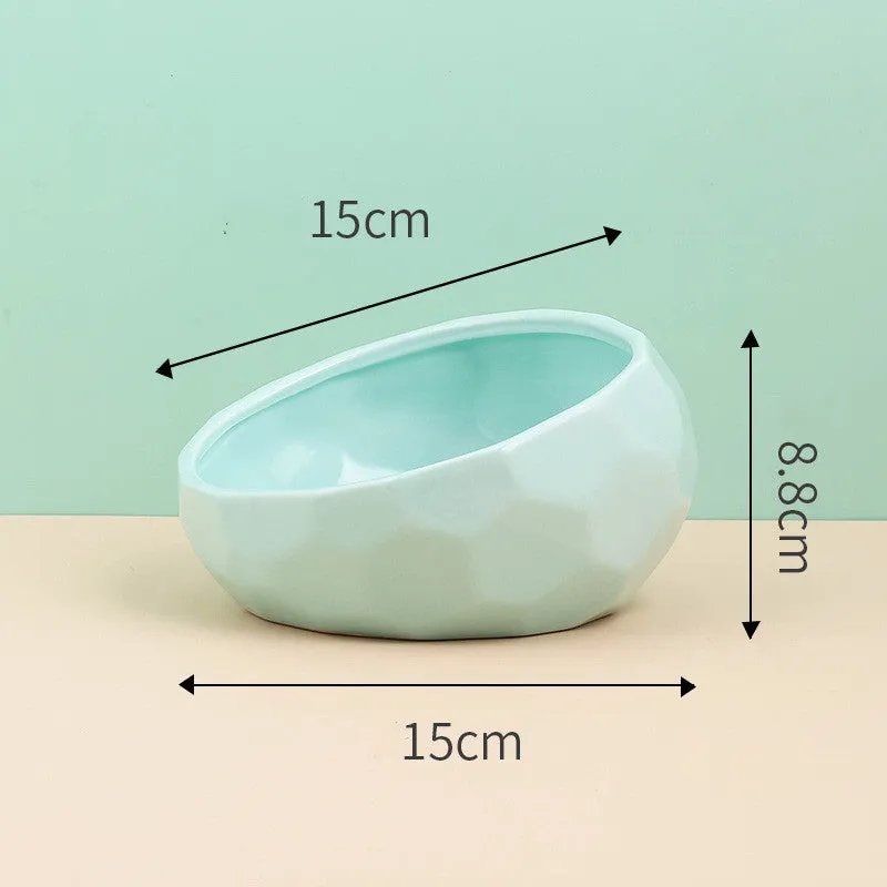 Ceramic cat bowl with oblique mouth design in white colour option on a surface