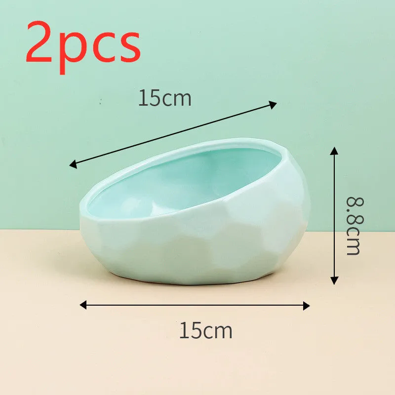Ceramic cat bowl with oblique mouth design in white colour option on a surface