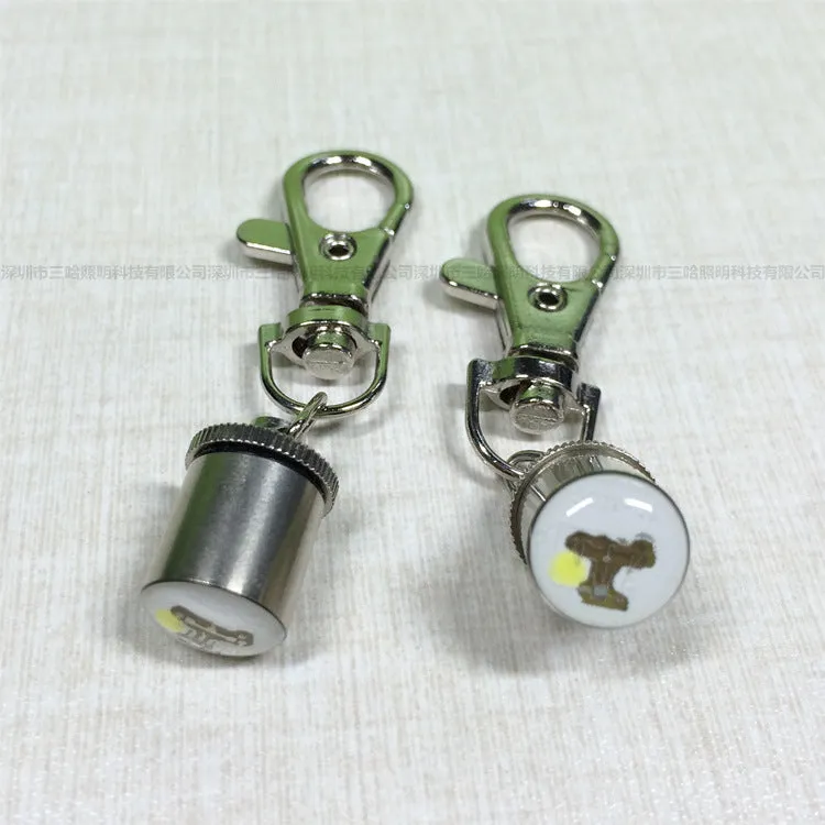 LED pet light in silver with copper alloy body showing 60mm length and 12mm width on a dog collar