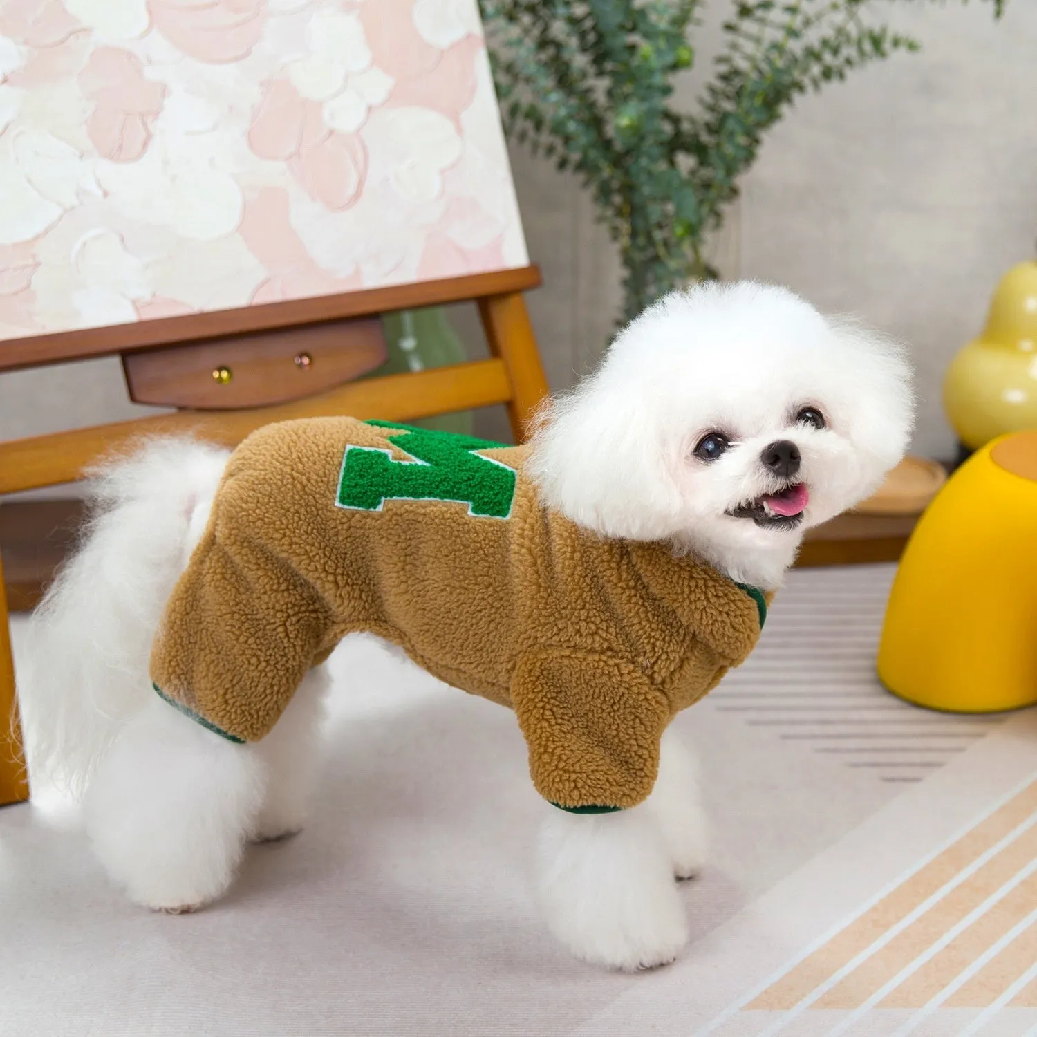Four legs fluffy jacket pet clothing in beige colour on a small dog, polyester fabric, casual style.