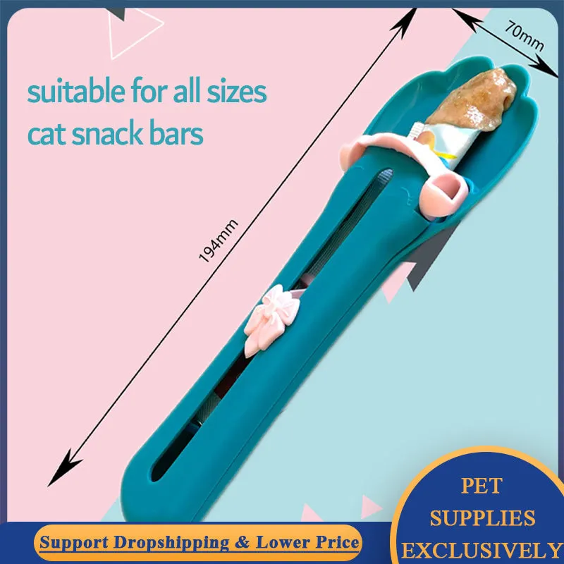 Green and pink pet food dispenser spoon with silicone squeezer tube for liquid cereal feeding