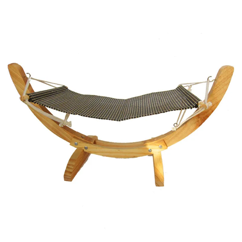 Cat hammock wooden bed with beige removable cushion on a radiator, providing a cosy perch for cats.