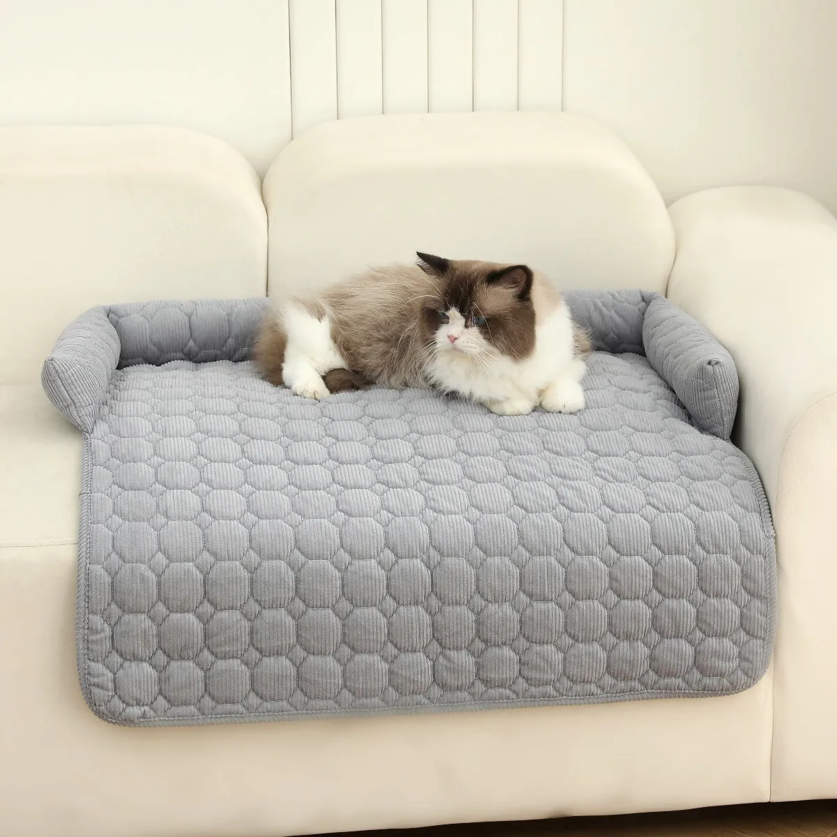 Thick corduroy pet bed mat with neck pillow in beige, 75x75cm, on a floor