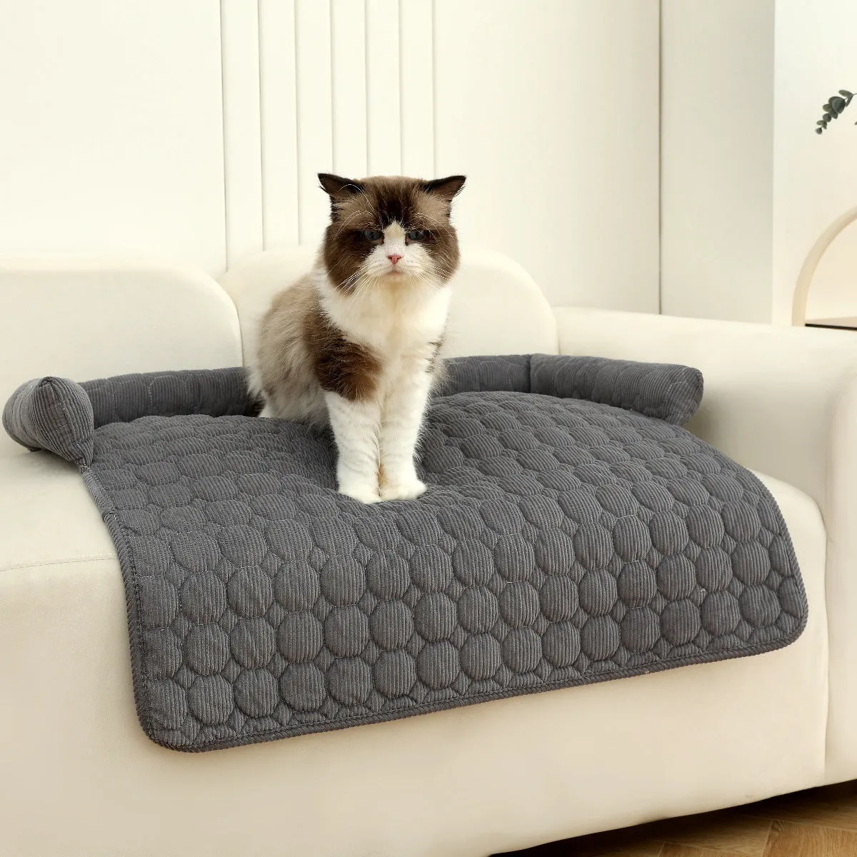 Thick corduroy pet bed mat with neck pillow in beige, 75x75cm, on a floor