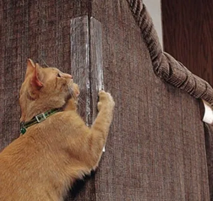 Two transparent PVC self-adhesive cat claw protector pads on a leather sofa arm, each 47x15cm