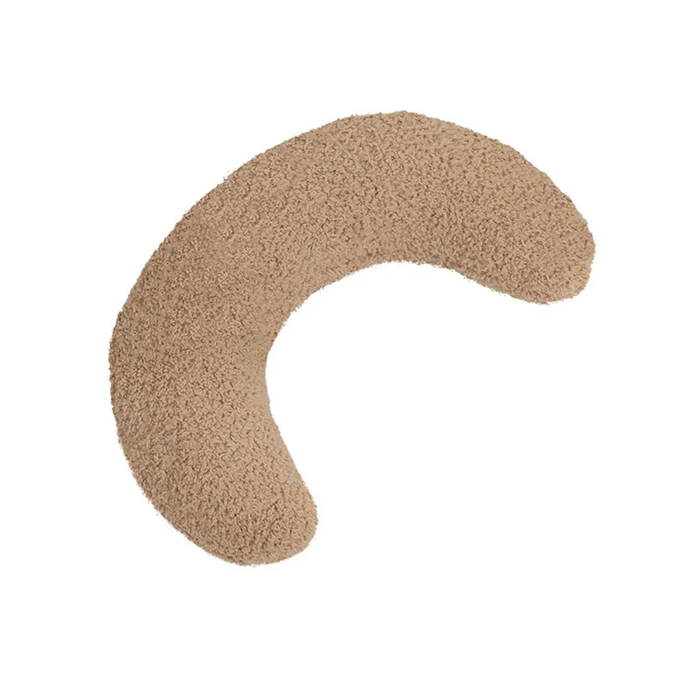 Blue U-shaped cat pillow with adjustable fabric collar on a sofa