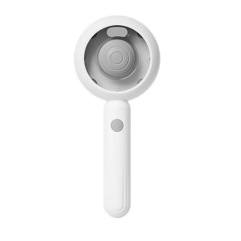 Grey and brown pet spray comb with stainless steel teeth and one-click mechanism on white background